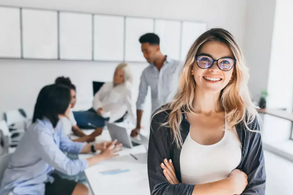 A man studying graphs, charts and notes on a wall