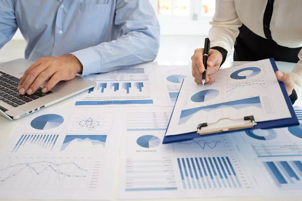 Business team discussing assessment and evaluation of corporate showing the results of their successful teamwork.