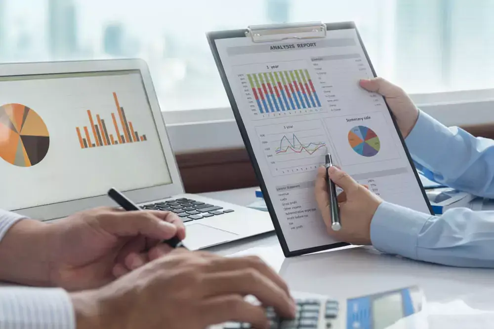 Financial team analyze data in report and consult for assessment and evaluation performance.